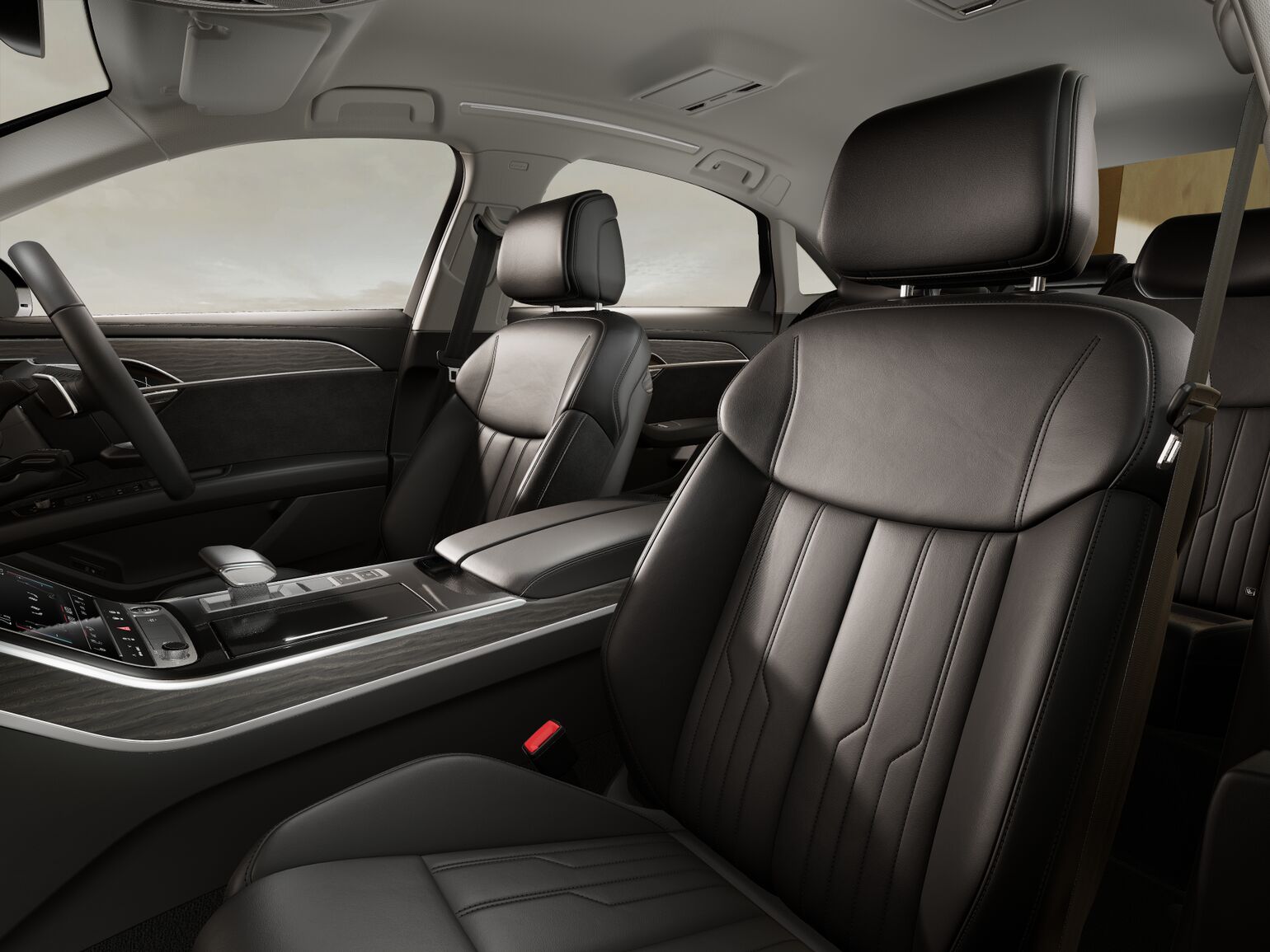 Interior of an Audi A8L featuring black leather seats, a central console with controls, and a sleek, minimalist dashboard design.